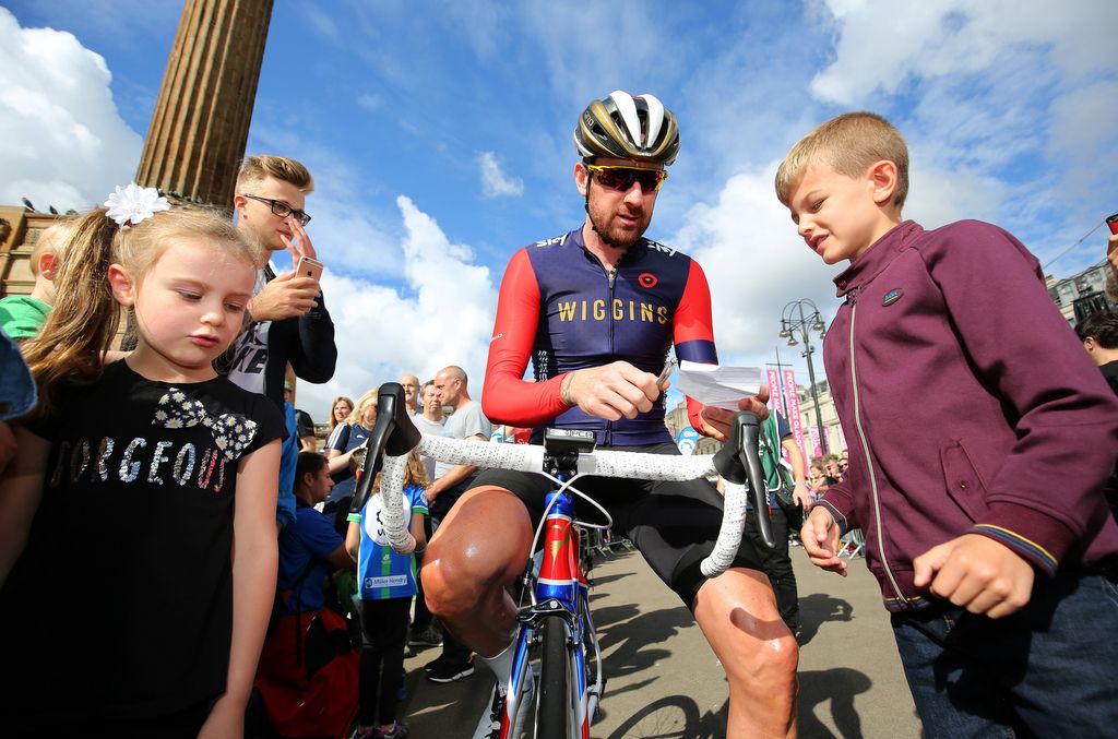 Bradley Wiggins (Team WIGGINS) signing autographs for some young fans