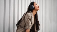 Sennheiser Momentum 4 Wireless review: woman wearing headphones