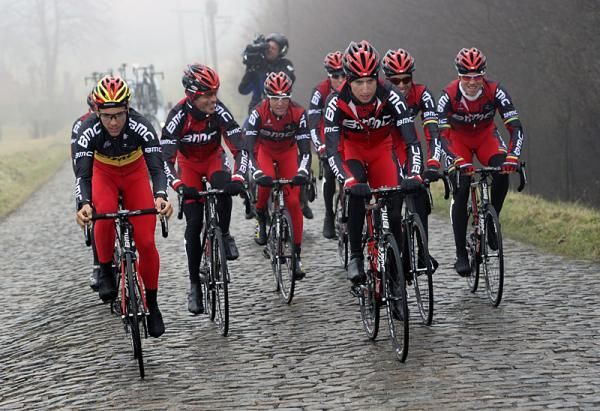 BMC's Philippe Gilbert and Taylor Phinney lead the team on a section of cobbles.