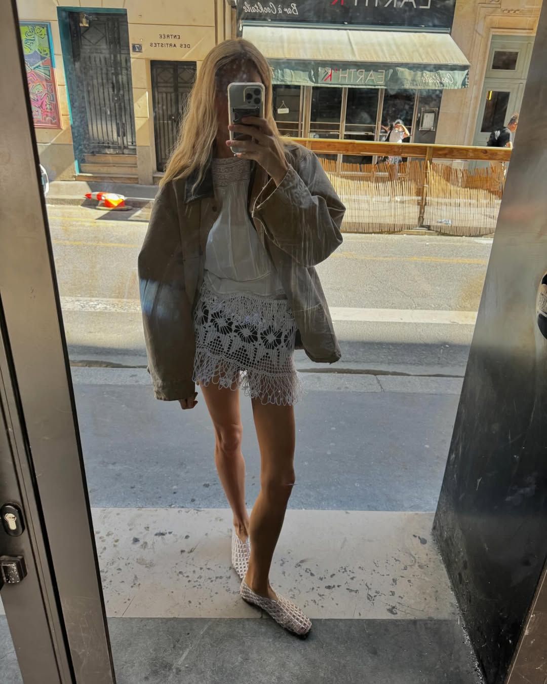 Courtney in white jelly flats