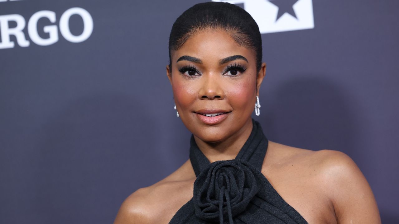 Gabrielle Union on the NAACP image awards red carpet in a gray halter gown