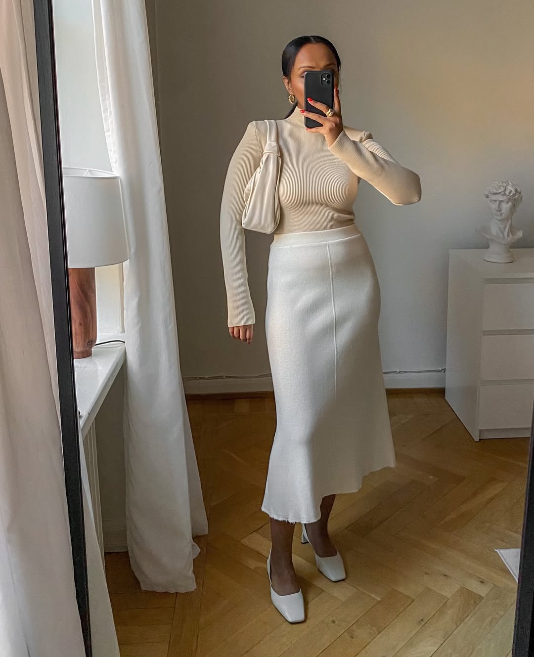 Lydia wearing neutral outfit