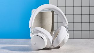 The AKG N9 Hybrid headphones photographed in front of a blue background.