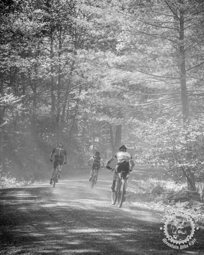 Riders race through dusty gravel roads