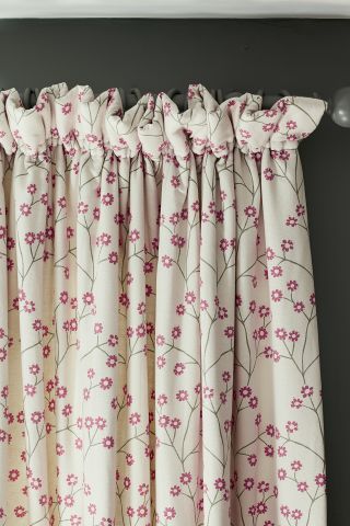 floral patterned curtains on curtain rod