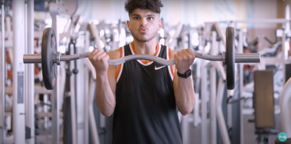 Omar THaher doing barbell curl