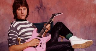 Jeff Beck wears a hooped-shirt and noodles on his pink Jackson Soloist, "Tina"