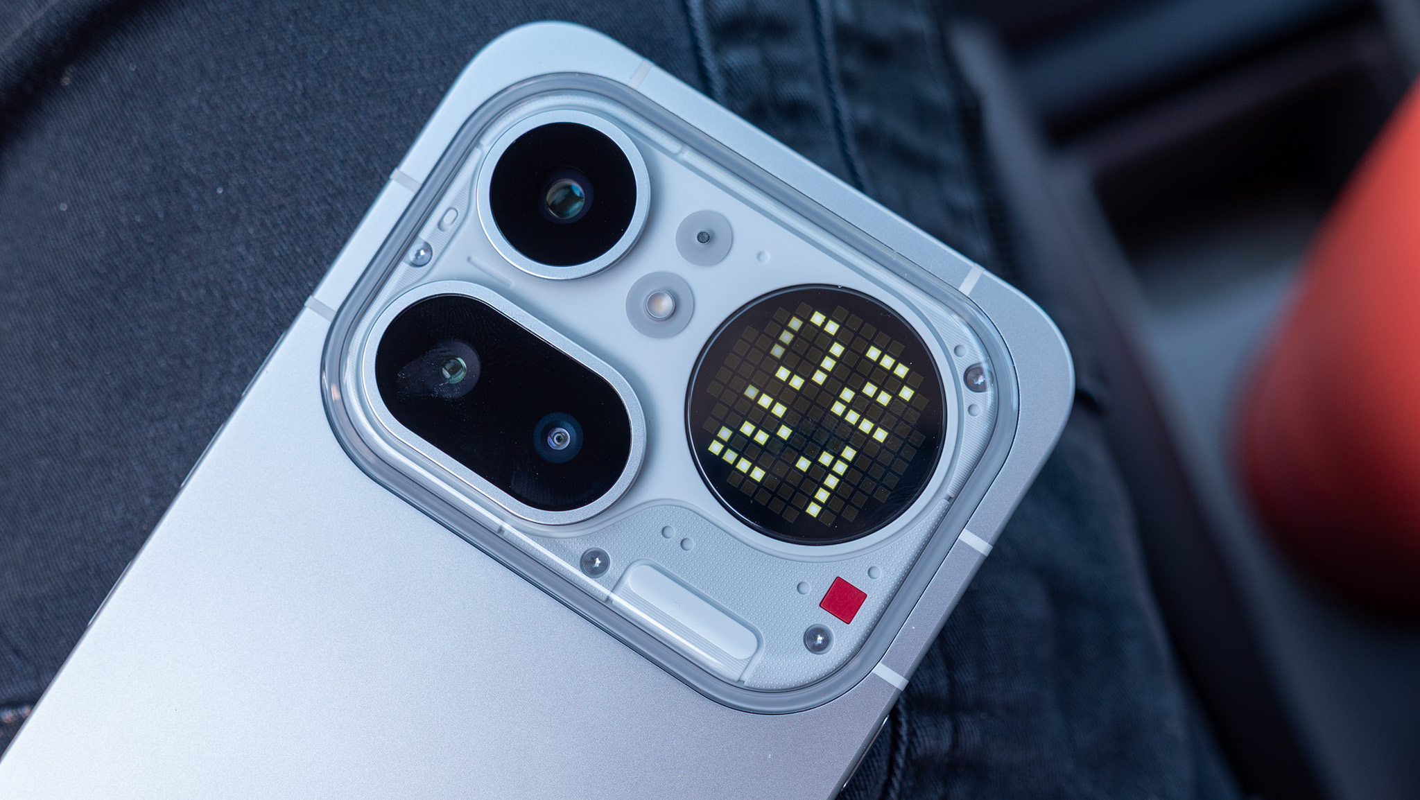 The Glyph Matrix on the back of the Nothing Phone 4a Pro showing an always-on clock