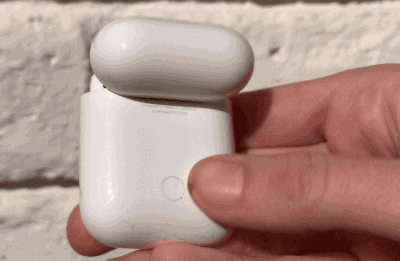 GIF of hand opening AirPods case