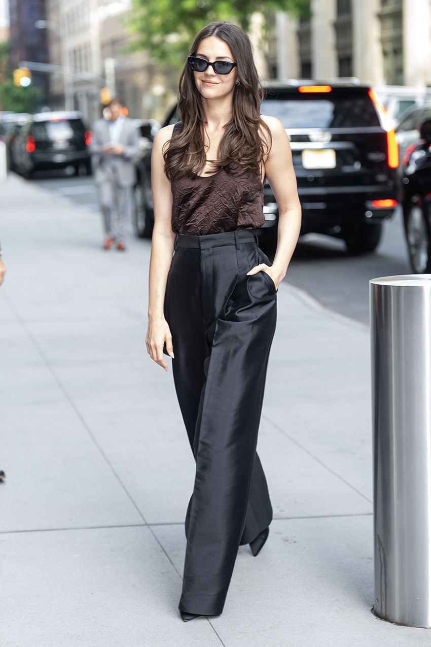 Ella Hunt wearing a Carven brown crinkled satin tank with black taffeta pants in NYC