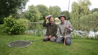 Bob Mortimer and Paul Whitehouse kneel next to a river for Mortimer and Whitehouse: Gone Fishing