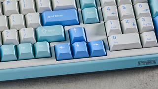 A white and blue Epomaker TH99 96% mechanical keyboard