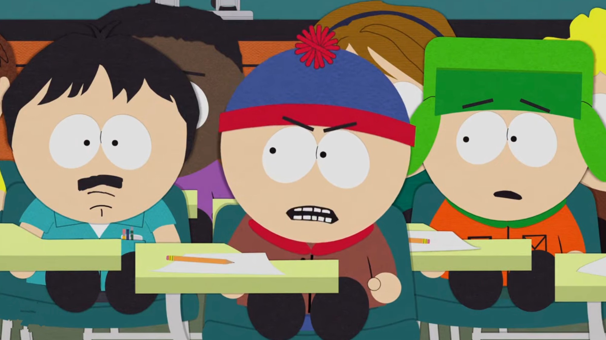 Randy sitting in class with Stan and Kyle. Kyle is very upset about it.