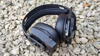 The Nacon Rig 900 Max HX gaming headset on white gravel