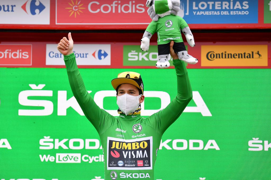 CIUDADRODRIGO SPAIN NOVEMBER 06 Podium Primoz Roglic of Slovenia and Team Jumbo Visma Green Points Jersey Celebration Mascot Mask Covid Safety Measures during the 75th Tour of Spain 2020 Stage 16 a 162km stage from Salamanca to Ciudad Rodrigo lavuelta LaVuelta20 La Vuelta on November 06 2020 in Ciudad Rodrigo Spain Photo by Justin SetterfieldGetty Images
