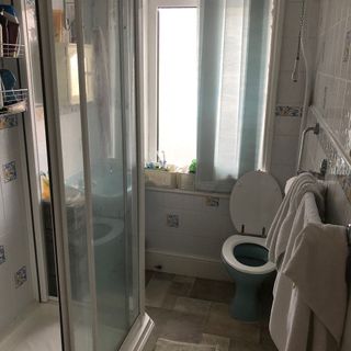 Before picture of a bathroom with shower
