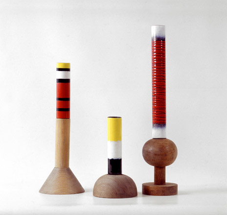 Enamelled copper vases on a wooden base