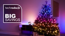 Christmas tree decorated with Philips Hue Festavia lights, with white text reading 'TechRadar Big Savings'