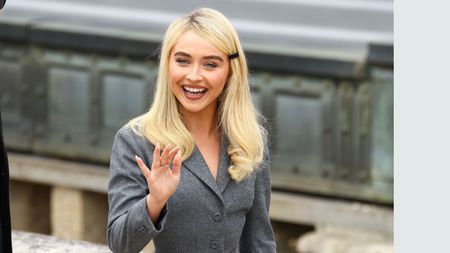 sabrina carpenter in a gray suit