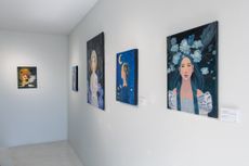 paintings displayed on a gallery wall