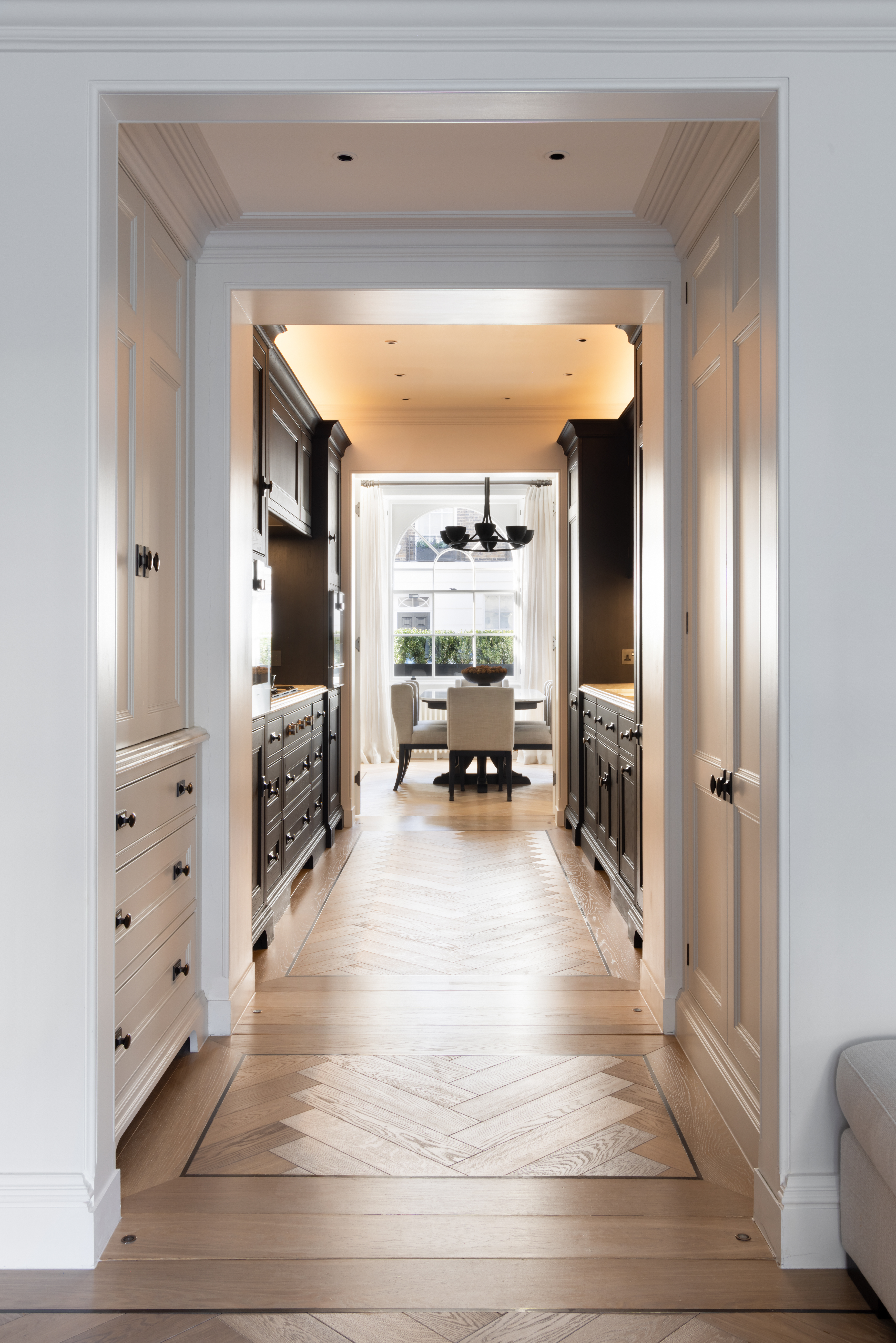 A London townhouse luxury galley kitchen view through