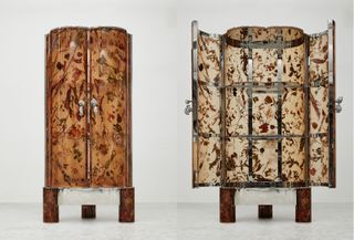 Two cabinets, one open one closed, made of translucent amber with embedded flowers, created by Marcin Rusak