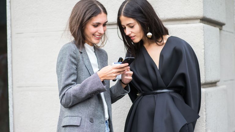 Clothing, Sleeve, Human body, Outerwear, Coat, Street fashion, Blazer, Grey, Long hair, Pocket,