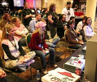 Members of the female gaming crew PMS Clan beat up on their male counterparts in Gears of War during the console tournament.