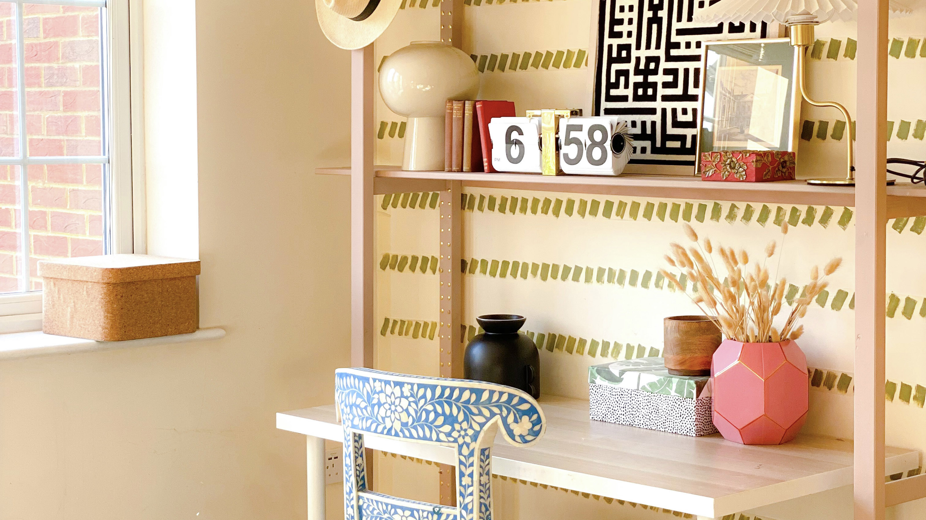 home office with wood shelving and vases on display