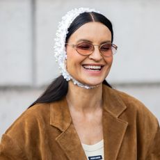 A fashion week attendee wearing brown blusher