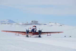 The Polar 6 plane from which researchers spotted the possible meteorite crater, with Princess Elisabeth station in the background.