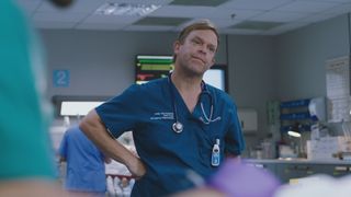 Dylan Keogh striking his classic hand-on-hip pose in Casualty.