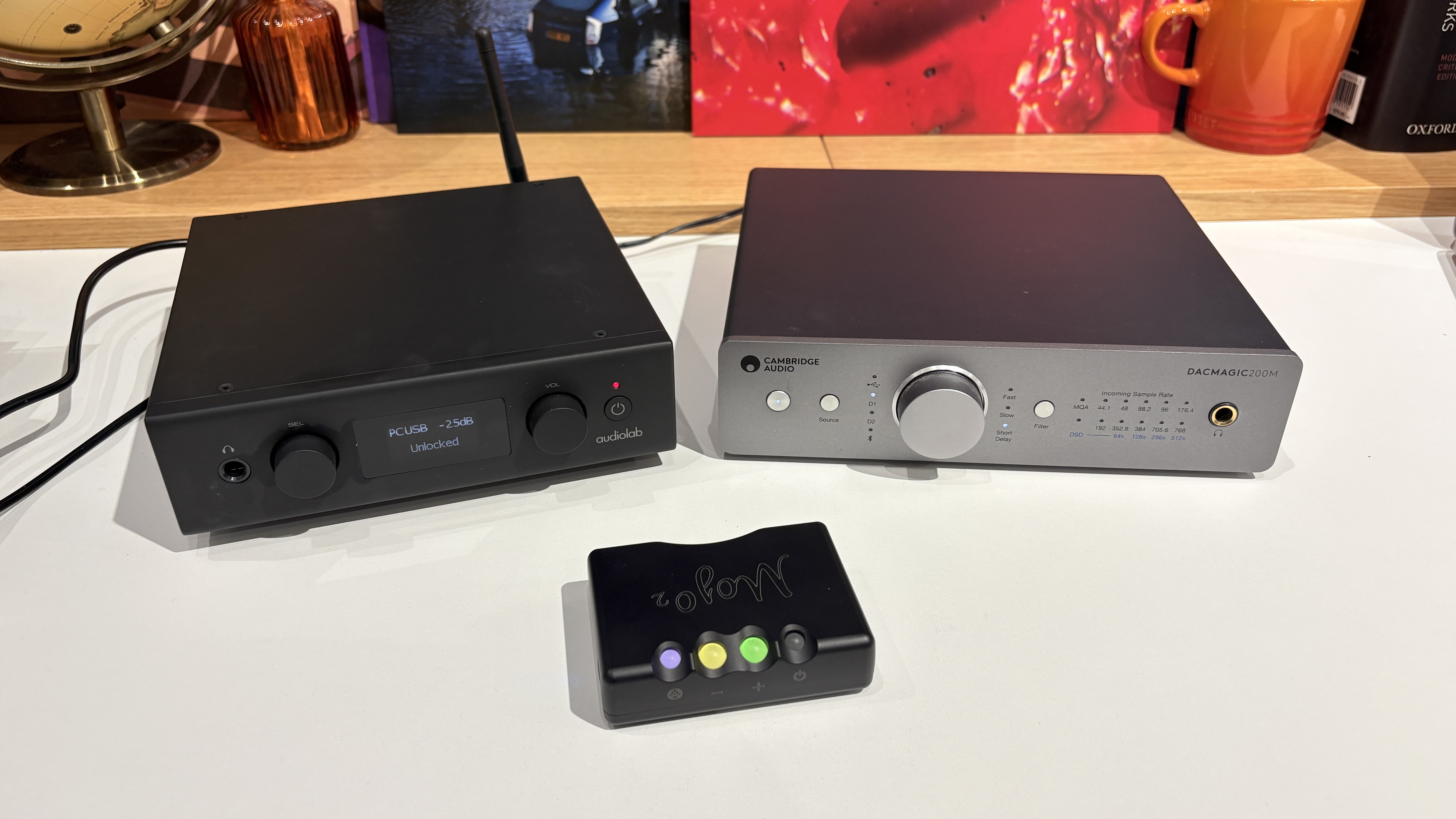 Audiolab D7, Cambridge Audio DacMagic 200M and Chord Mojo 2 DACs on white desk