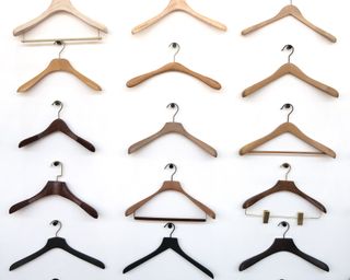 An assortment of different hanger types on white background