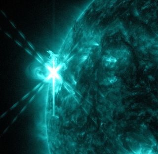 NASA's Solar Dynamics Observatory captured this image of an M5.7-class flare on May 3, 2013, at 1:30 p.m. EDT. This image shows light in the 131-angstrom wavelength, a wavelength of light that can show material at the very hot temperatures of a solar flare and that is typically colorized in teal.