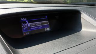 A car dashboard showing Sound Settings.