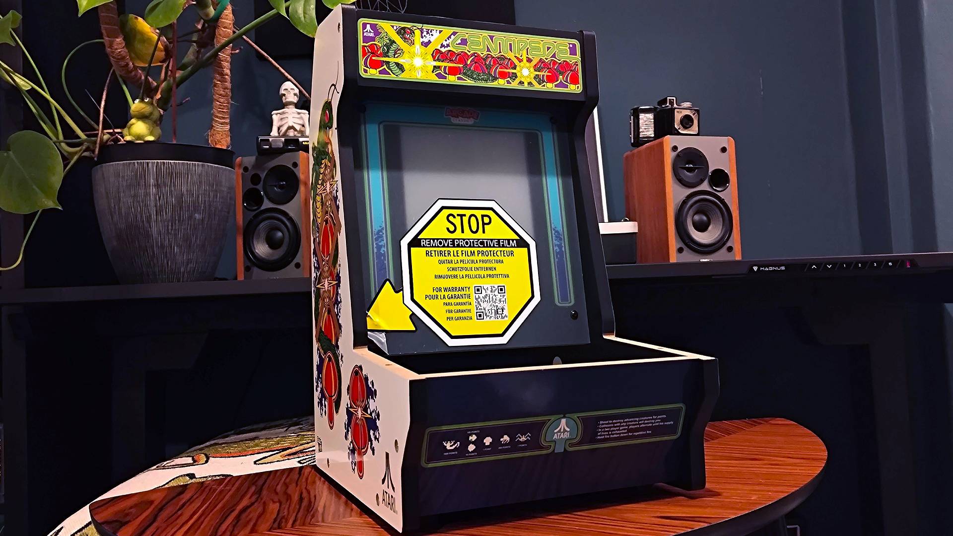 Assembled Arcade Classics Centipede cabinet on woodgrain coffee table.