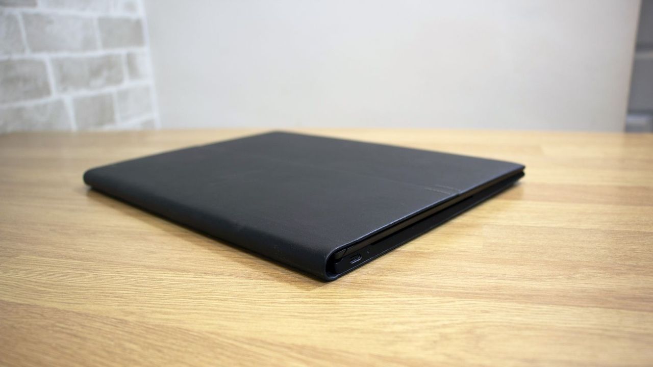 A photograph of the HP Elite Folio closed on a table