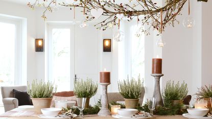 Halloween table display with candles and branches