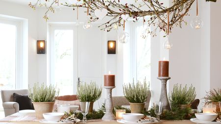 Halloween table display with candles and branches