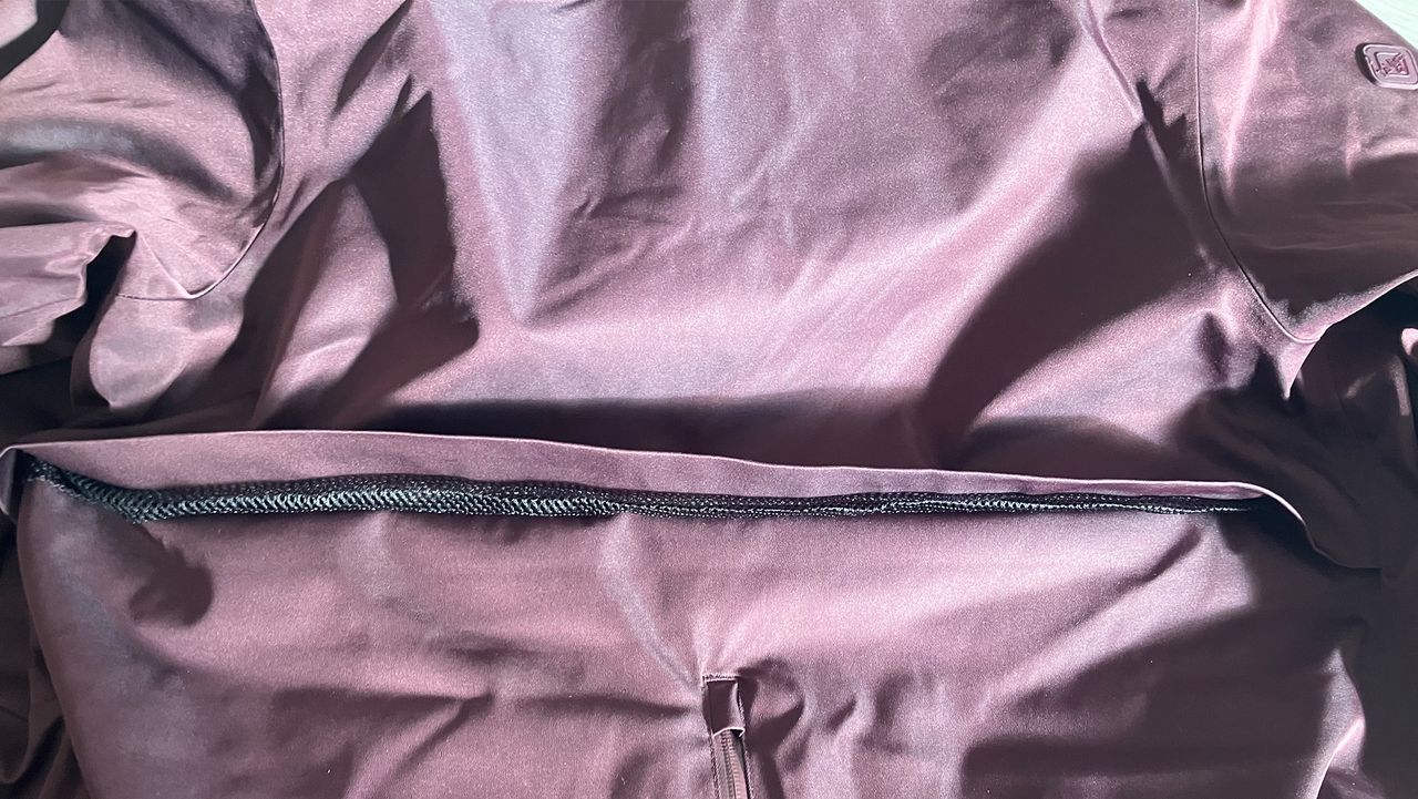 LeMieux All Elements Robe on the floor with a close up of air vents on the outside of coat