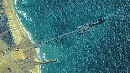 A temporary pier enabled the maritime delivery of international humanitarian aid to the United Nations in Gaza for distribution to Palestinian people