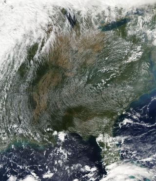 The circular pattern to the clouds, which stretches from Ohio to Florida and from Arkansas to the Atlantic Coast, was caused by the flow of air around a sprawling high-pressure ridge centered in western Virginia, North Carolina and eastern Tennessee. This