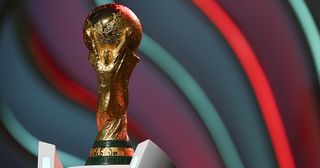 The World Cup trophy is seen during rehearsal ahead of the FIFA World Cup Qatar 2022 Final Draw at Doha Exhibition Center on April 01, 2022 in Doha, Qatar.