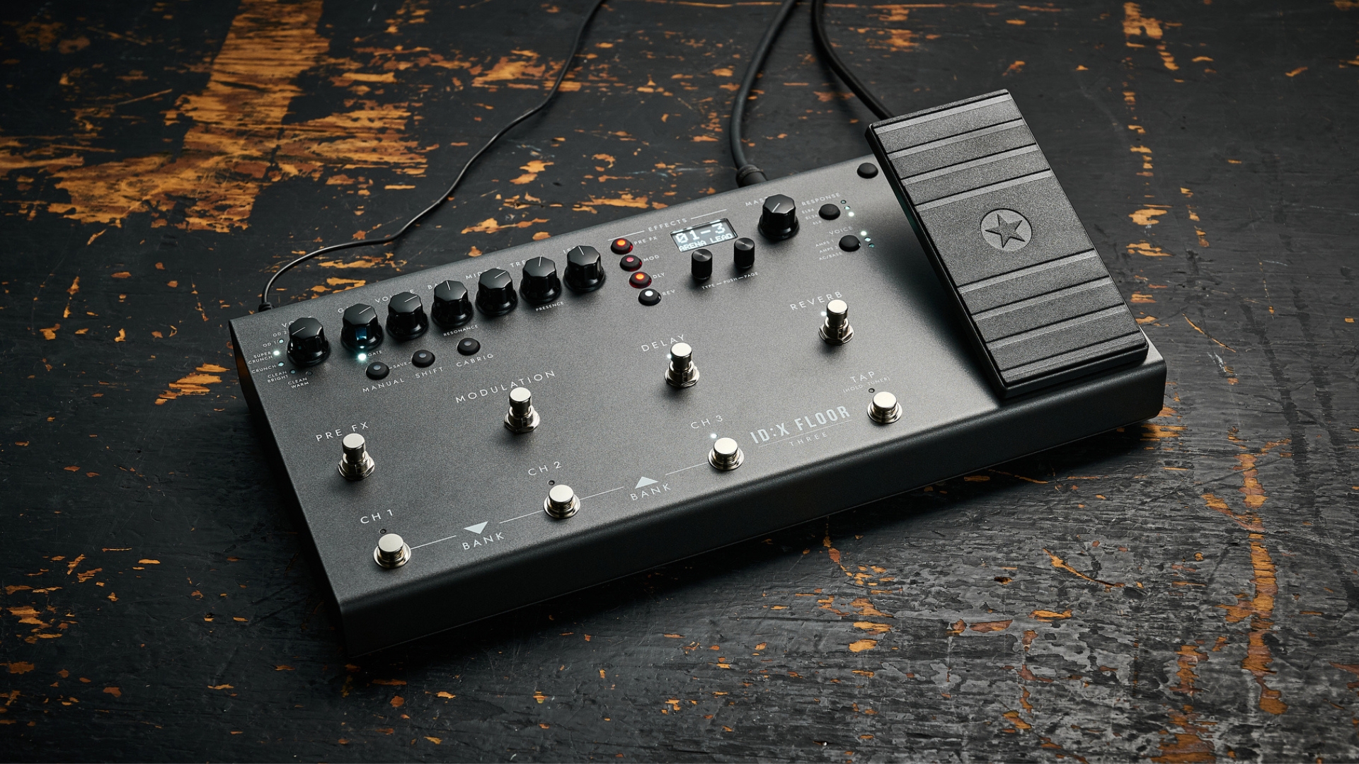 A Blackstar ID:X Floor Three multi-effects pedal on a worn, wooden floor
