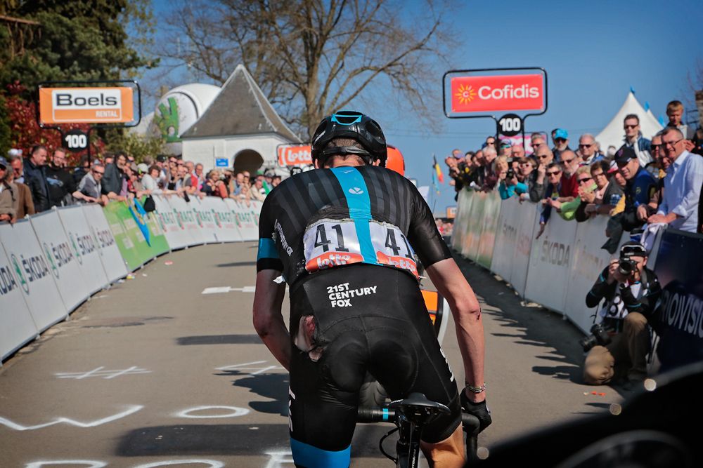 A damaged Chris Froome climbs toward the finish.