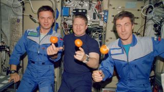 Expedition 1 crew members Yuri Gidzenko, Bill Shepherd and Sergei Krikalev on board the Zvezda service module of the International Space Station (ISS). 