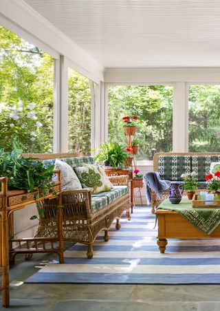 small sunroom with striped blue rug