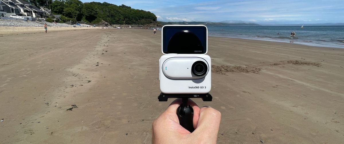 Insta360 GO 3 action camera on a beach