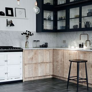Kitchen with white walls and black cabinet